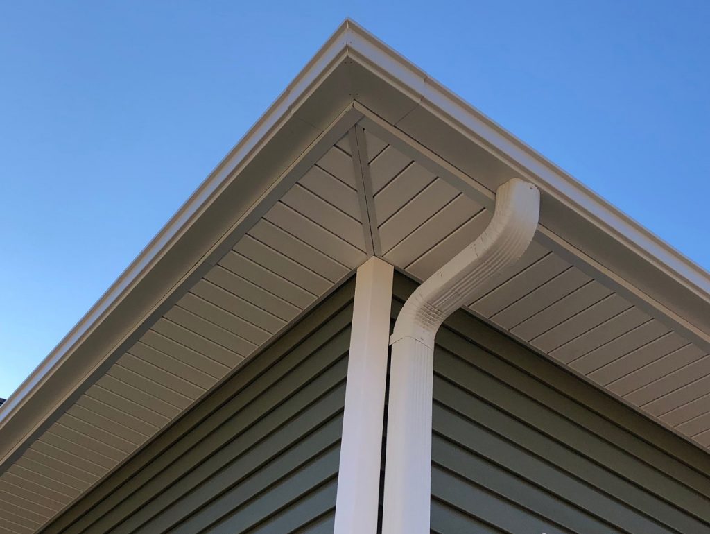 Corner of a house with Seamless Gutters and downspout. 

Look No Further than True Roofing & Contracting for Seamless Gutter Installation Jackson MS